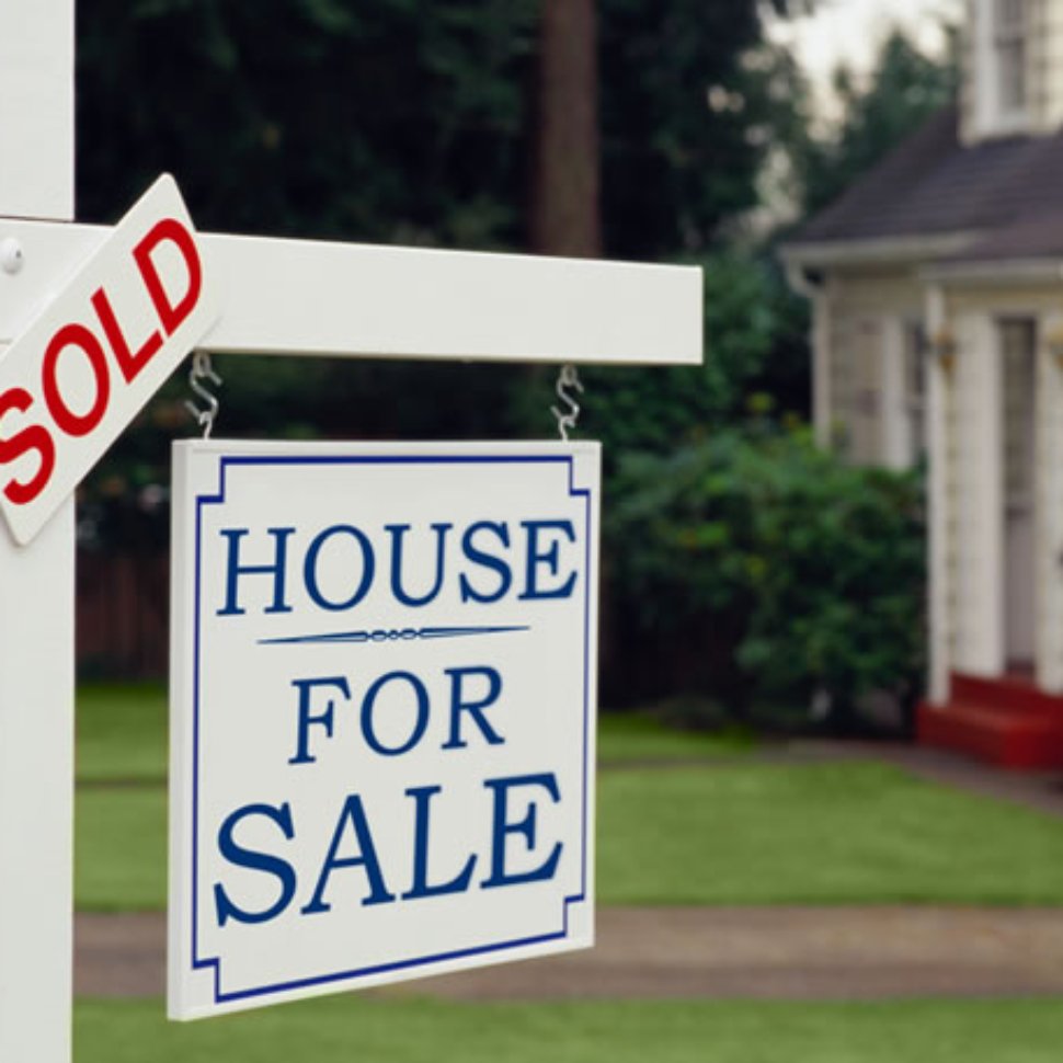 A house for sold with the white signboards