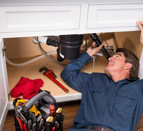 Inspector checking the mold from sink lower