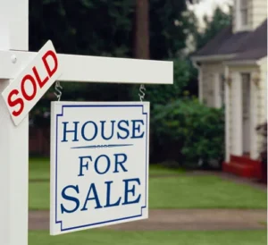A house for sold with the white signboards